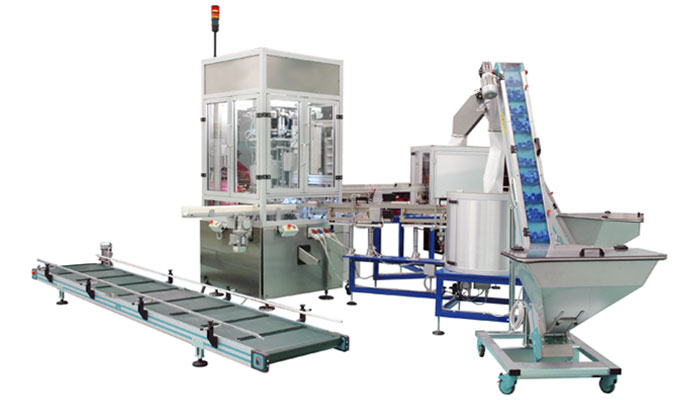 CARTON-BOX CLOSURE ASSEMBLY MACHINE